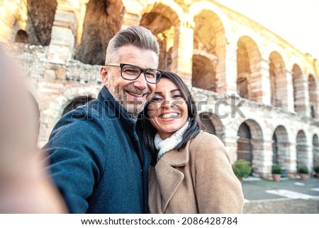 Married couple of tourists taking a selfie portrait visiting Italy - Senior man and woman enjoying weekend vacation - Happy lifestyle concept Royalty-Free Stock Photo #2086428784