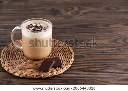 Mocha of coffee with chocolate and coconut milk in a glass cup. Sugar, gluten and lactose free.