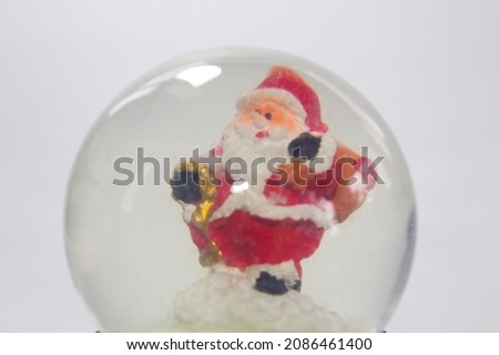 Santa Claus inside a glass globe