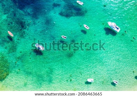 Beautiful Mediterranean sea in Greece. Aerial abstract view of tropical idyllic summer landscape with blue sea water, and boats Royalty-Free Stock Photo #2086463665