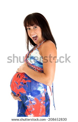 Pregnant mother wearing colorful dress excited expression