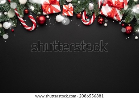 Black background with christmas decorations and and copy space for text