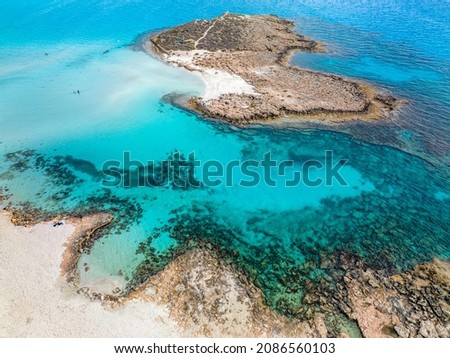 Nissi Beach in Ayia Napa, clean aerial photo of famous tourist beach in Cyprus, the place is a known destination on island and is formed from a smaller island just near the main shore Royalty-Free Stock Photo #2086560103
