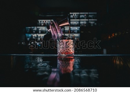 woman hand bartender making cocktail in bar Royalty-Free Stock Photo #2086568710