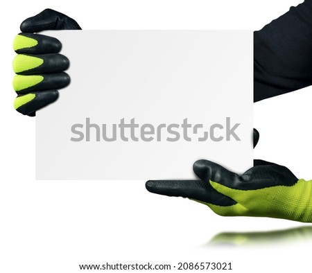 Blue-collar worker with protective work gloves holding a blank banner isolated on white background with copy space.