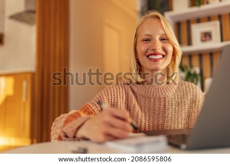 Picture of cheerful caucasian woman, having a fun day at home office.