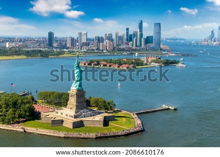 Panoramic aerial view Statue of Liberty and Jersey City and Manhattan cityscape in New York City, NY, USA Royalty-Free Stock Photo #2086610176