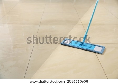 Washing of floor with mop. Difference before and after cleaning Royalty-Free Stock Photo #2086610608