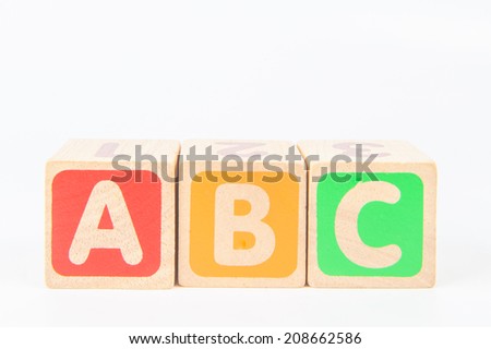 wooden toy cubes with letters. Wooden alphabet blocks. Royalty-Free Stock Photo #208662586