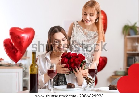 Happy transgender couple celebrating Valentine's Day at home