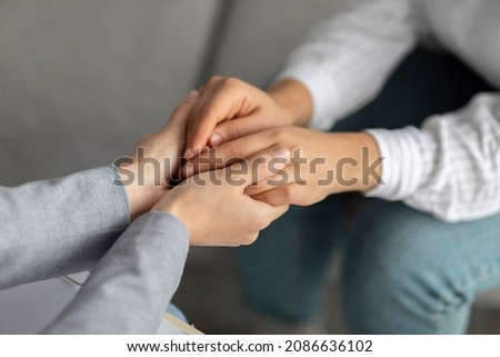 Psychological support. Psychotherapist offering help to young woman, holding her hands during psychotherapy session, closeup. Unrecognizable psychiatrist providing assistance to female patient Royalty-Free Stock Photo #2086636102