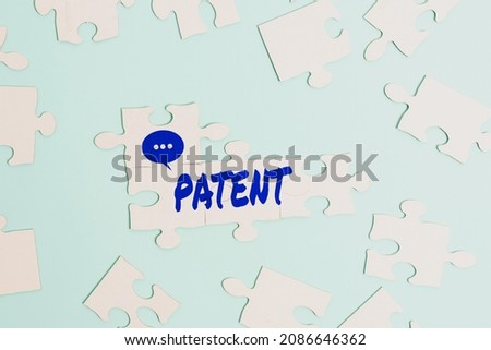 Sign displaying Patent. Business overview government authority or licence conferring a right or title Building An Unfinished White Jigsaw Pattern Puzzle With Missing Last Piece