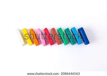 Сhild colorful plasticine on white background top view