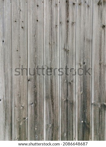 Grey brown weathered wood plank background. Vertical version with vertical stripes.
