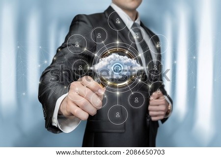 Business man explores cloud data updated on blurred background.