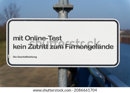  Restricted access at the entrance to a company site in germany during the Corona Pandemic.
Translation of the German text: with online test no access to the company premises. The Management.        