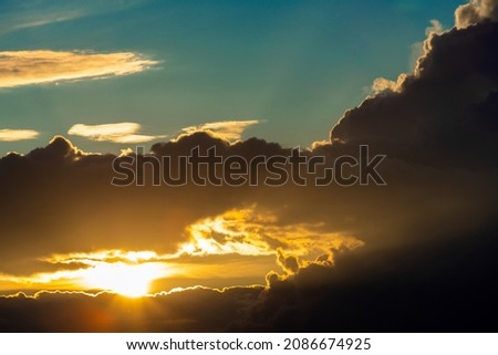 Beautiful bright sunset. Panoranic Sunrise Sky with colorful clouds 