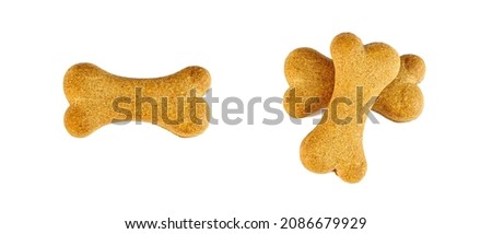 Top view of crunchy brown bone shaped dog biscuit as a treat set isolated on white background close up Royalty-Free Stock Photo #2086679929