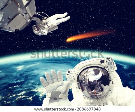 Different spaceships above the earth. Austronauts in outer space. The elements of this image furnished by NASA.

