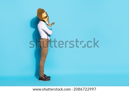 Photo of cool confident guy dressed wild animal mask arms crossed empty space isolated blue color background
