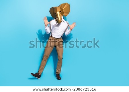 Full body photo of young man have fun dance show event surreal african isolated over blue color background