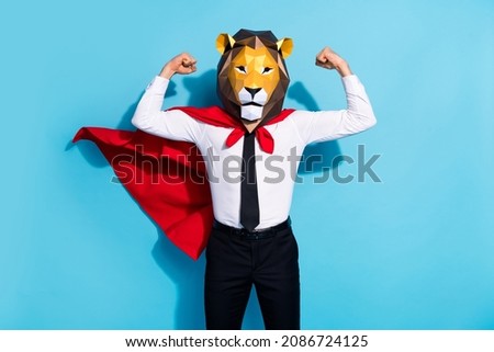 Photo of strong courage guy lion mask save planet world show muscles isolated over blue color background