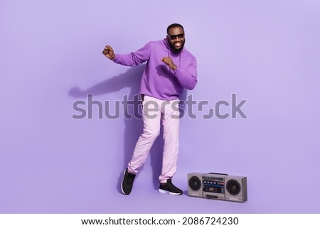 Full length body size view of attractive cheerful carefree guy dj dancing having fun rest isolated on violet purple color background
