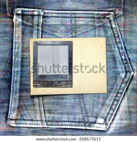 Vintage postcard with paper slides on old jeans background
