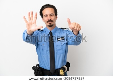 Young police man over isolated background white counting six with fingers