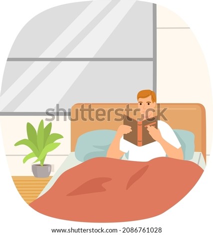 Cute man in pajamas reading literature on his bed comfortably. Book lover concept with young man lying relax on sofa and reading book. Concept of homeward and comfort. Person relaxes after work Royalty-Free Stock Photo #2086761028