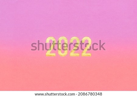 Happy New Year theme and design, Season greeting concept, Blank hot pink with shining golden number of 2022, Dual tone color purple rose with free copy space, Abstract background.