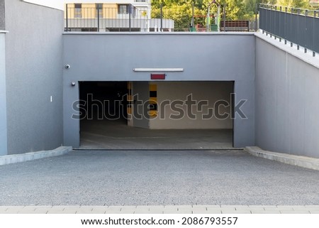 Open garage gate in the modern residential building