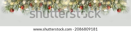 Christmas background with Christmas trees. Christmas tree branches and red balls and stars. Bokeh. Long banner. Copy space