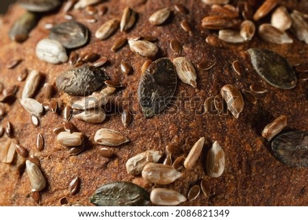 Close-up surface of homemade whole grain bread, food background, texture