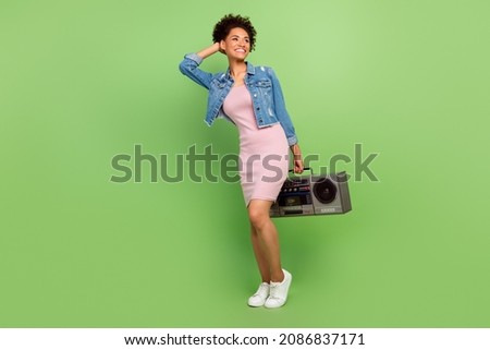 Full body photo of cute young lady with boom box look wear dress shirt sneakers isolated on green background