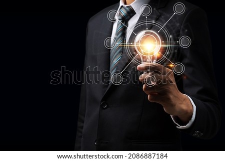 Idea. businessman investor hand holding vintage light bulb with virtual screen global link connecting diagram on dark background, inspiration, innovation, digital, internet, communication concept
