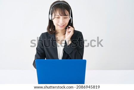 Asian operator working in white background