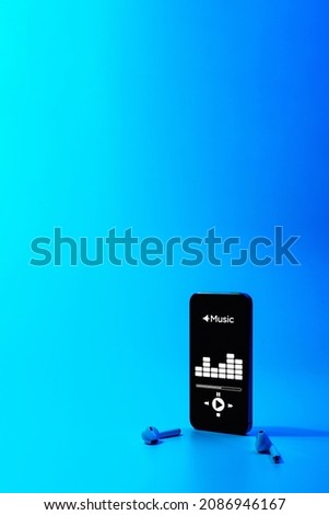 Music application. Mobile smartphone screen with music app, sound headphones. Audio voice with radio beats on blue gradient. Recording studio or podcasting banner with copy space