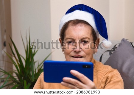 woman doing a video conference at Christmas to congratulate the family