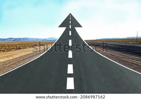 Creative road arrow on beautiful landscape background with mock up place. Direction, way and success concept Royalty-Free Stock Photo #2086987162