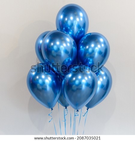 Composition of bright blue helium balloons
