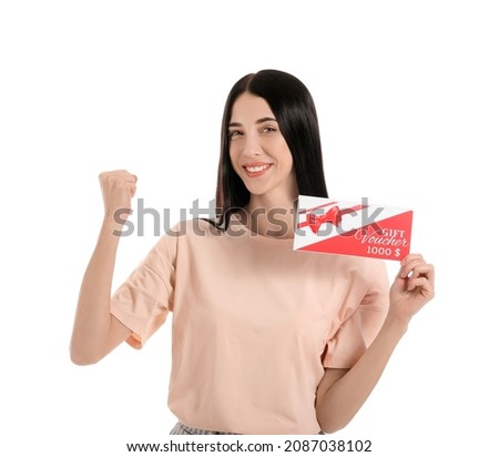Happy young woman with gift voucher on white background