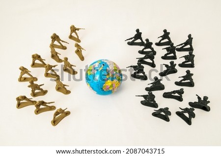Plastic Lead Soldiers Representing War on a White Background Royalty-Free Stock Photo #2087043715
