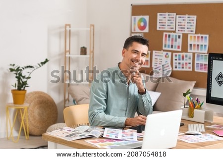 Graphic designer working in office Royalty-Free Stock Photo #2087054818