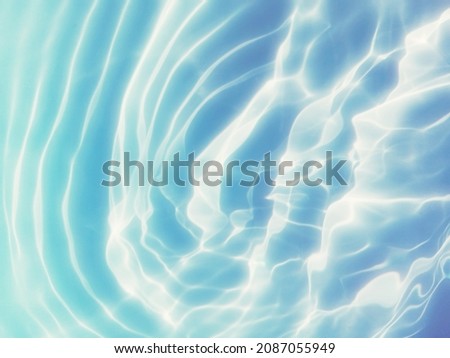 The abstract of blue water texture on the sea. Blue sea water for​ background. The pattern of surface blue water use for background. Reflection​ of surface​ blue​ water​ for​ background.