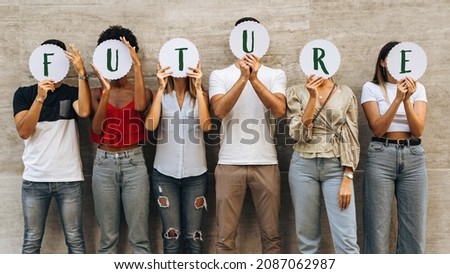Group of young people hiding their face with the world Future - what prospects for new generations?- Concept of youth wondering about his future. Royalty-Free Stock Photo #2087062987