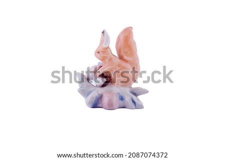 Decorative ceramic squirrel on a white background