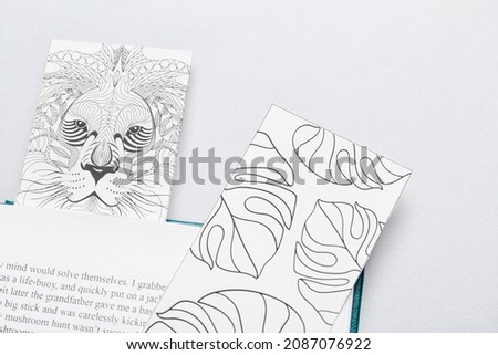 Cute bookmarks with book on light background