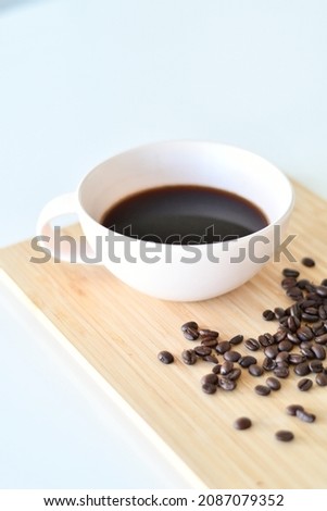 Black coffee in a white mug, Coffee beans