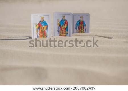 The Magi from the East. Christmas scene in the desert with playing cards.